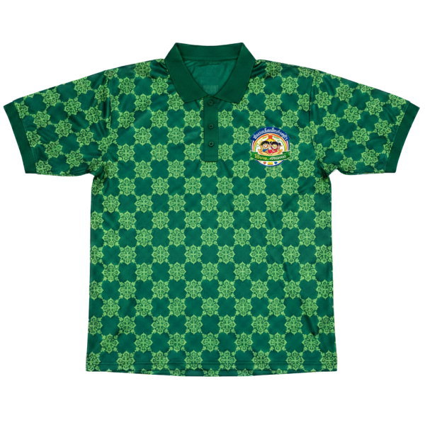 เสื้อโปโลพิมพ์ลายตารางสีเขียว ด้านหน้า พร้อมโลโก้สถานสงเคราะห์เด็ก กิจกรรมระดมทุน พิมพ์ซับลิเมชั่น โดย Sport Mighty